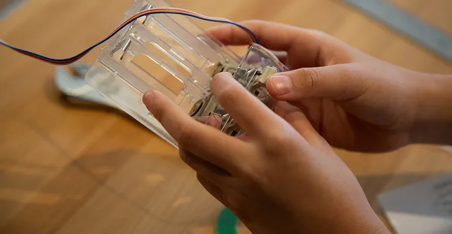 Child holding a digital controller